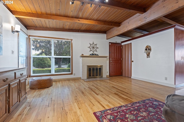 1833 SE 117th Ave, Portland, OR 97216 - unfurnished living room featuring a fireplace, baseboards, wooden ceiling, and light wood-type flooring