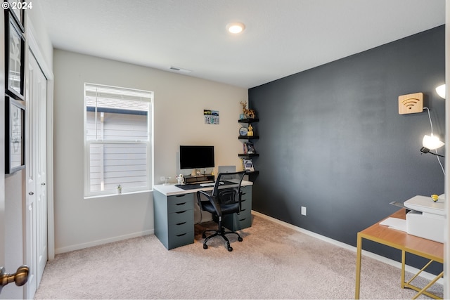 carpeted office with visible vents, baseboards, and a healthy amount of sunlight