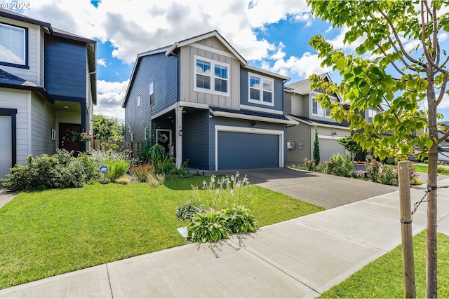 view of front of home with board and batten siding, a garage, driveway, and a front lawn