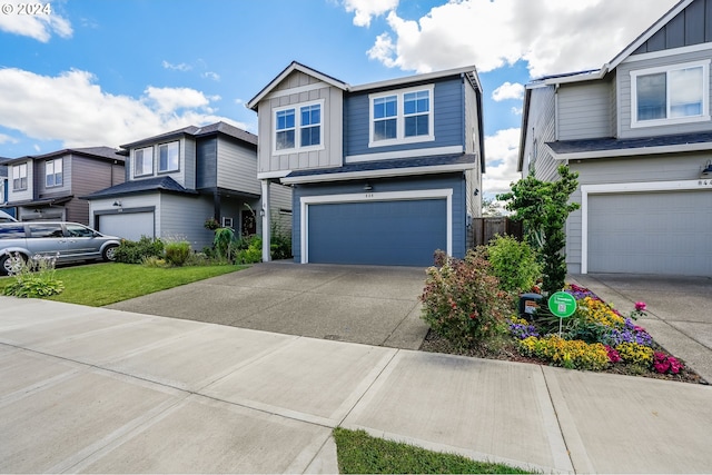 view of front facade featuring an attached garage, board and batten siding, and concrete driveway