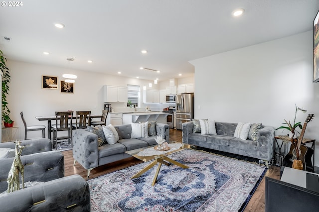 living room featuring recessed lighting and light wood-type flooring