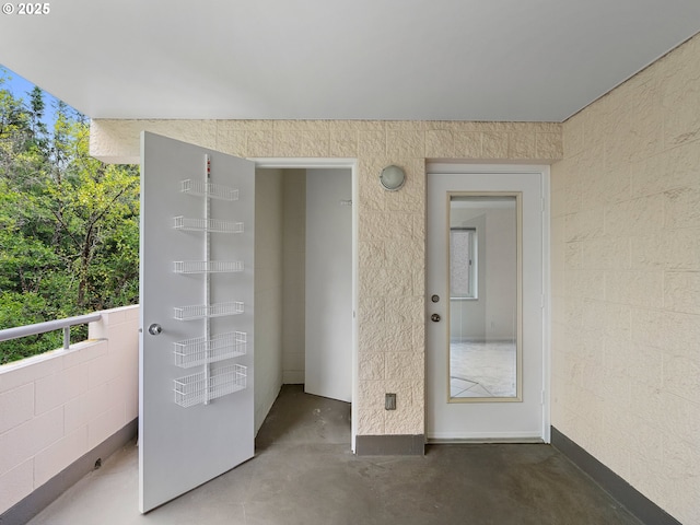 doorway to property featuring a balcony