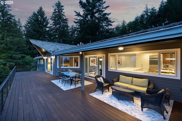 deck featuring outdoor lounge area and outdoor dining space