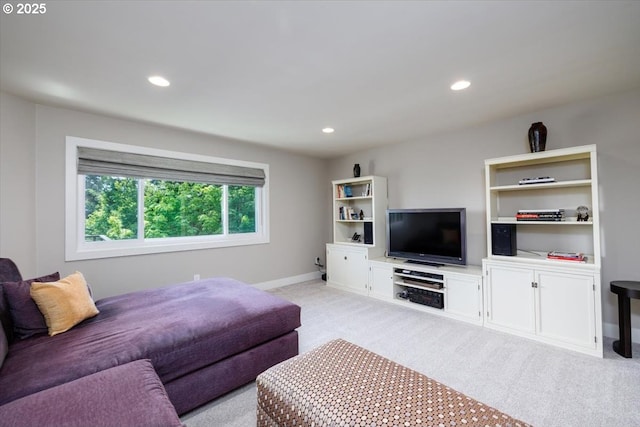 living room featuring recessed lighting, baseboards, and light colored carpet