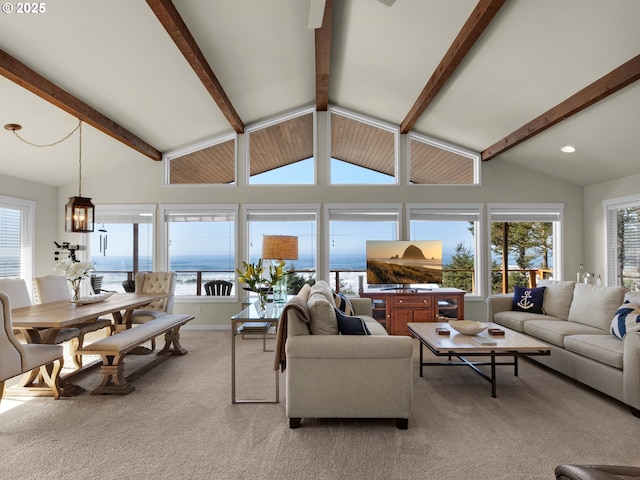 living room featuring beamed ceiling, baseboards, light colored carpet, and high vaulted ceiling