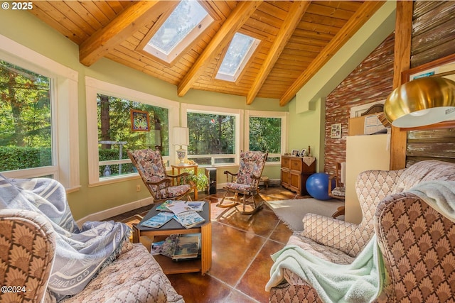 2165 NE E Devils Lake Rd, Otis, OR 97368 - sunroom with a skylight, healthy amount of natural light, wooden ceiling with exposed beams, baseboards, and high vaulted ceiling