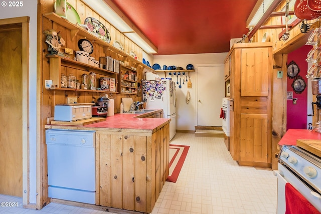 2165 NE E Devils Lake Rd, Otis, OR 97368 - kitchen featuring white appliances, light floors, open shelves, and a sink