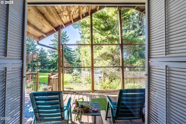 2165 NE E Devils Lake Rd, Otis, OR 97368 - sunroom with view of scattered trees and vaulted ceiling