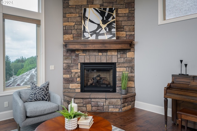 3232 NW Spencer St, Portland, OR 97229 - living area featuring wood finished floors and a stone fireplace