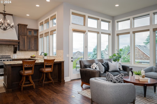 3232 NW Spencer St, Portland, OR 97229 - living room featuring plenty of natural light, recessed lighting, dark wood-style flooring, and a chandelier