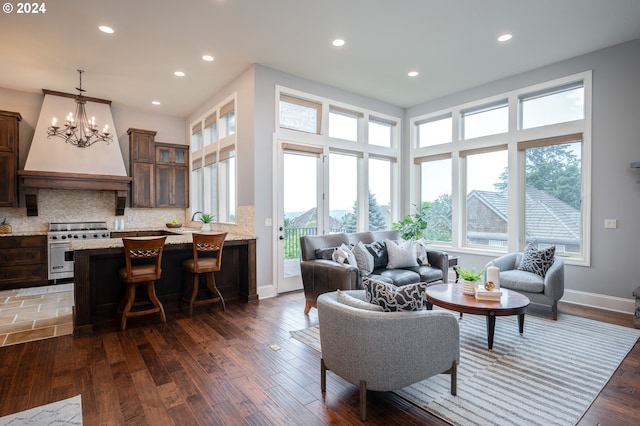 3232 NW Spencer St, Portland, OR 97229 - living room featuring healthy amount of natural light, wood finished floors, recessed lighting, and a chandelier