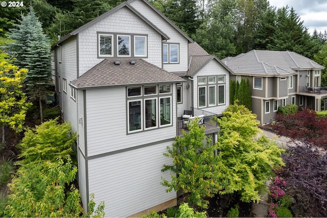3232 NW Spencer St, Portland, OR 97229 - rear view of house with a shingled roof