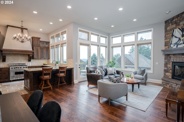 3232 NW Spencer St, Portland, OR 97229 - living area featuring healthy amount of natural light, a fireplace, recessed lighting, and light wood-style flooring
