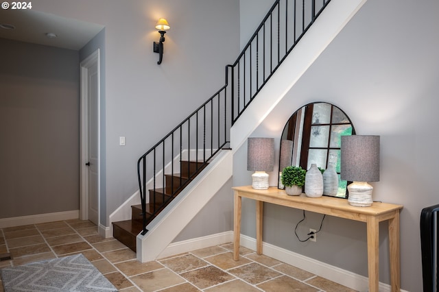 3232 NW Spencer St, Portland, OR 97229 - stairs with stone tile floors and baseboards