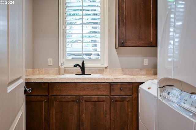 3232 NW Spencer St, Portland, OR 97229 - laundry room featuring cabinet space and washer and dryer