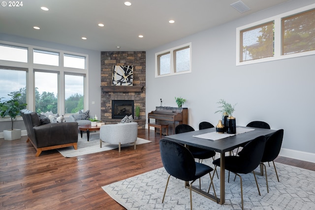 3232 NW Spencer St, Portland, OR 97229 - dining room with recessed lighting, a stone fireplace, and wood finished floors