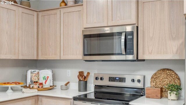 6138 SE 15th St, Gresham, OR 97080 - kitchen featuring stainless steel appliances, light brown cabinetry, and light countertops