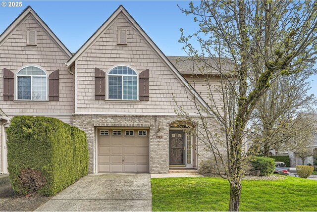 view of front facade featuring a front lawn, a garage, and concrete driveway