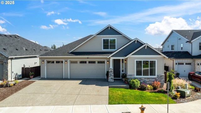 4905 S 12th Cir, Ridgefield, WA 98642 - view of front facade featuring concrete driveway, a garage, and stone siding