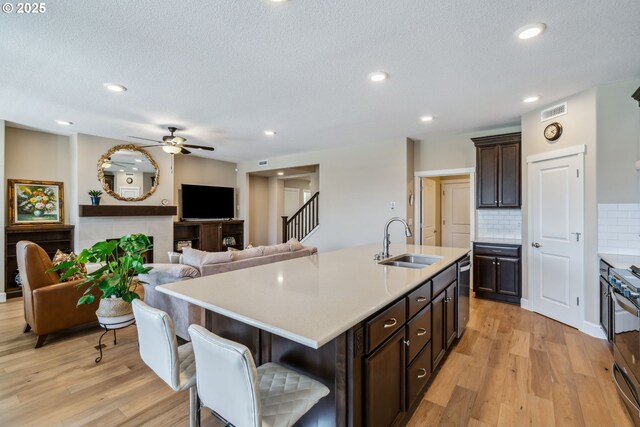 4905 S 12th Cir, Ridgefield, WA 98642 - kitchen featuring stainless steel appliances, light wood-type flooring, ceiling fan, light countertops, and recessed lighting