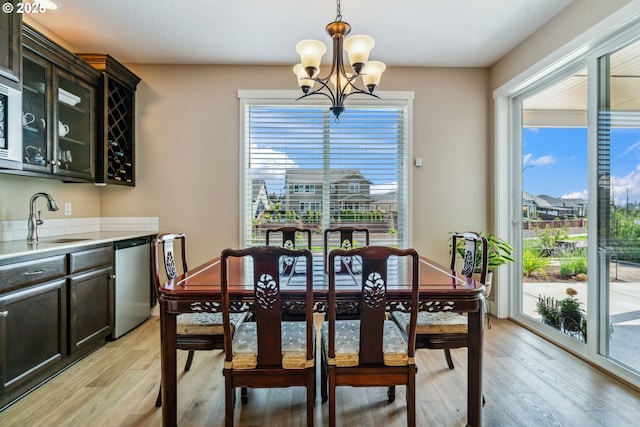 4905 S 12th Cir, Ridgefield, WA 98642 - dining area featuring a chandelier and light wood-style flooring