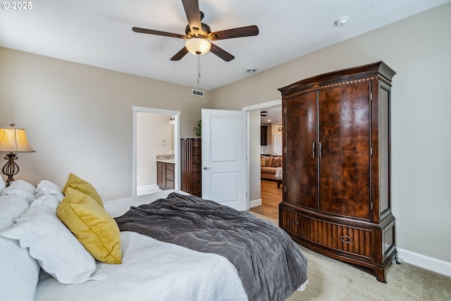 4905 S 12th Cir, Ridgefield, WA 98642 - bedroom featuring ensuite bathroom, light colored carpet, and ceiling fan