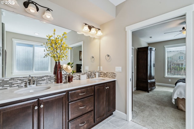 4905 S 12th Cir, Ridgefield, WA 98642 - ensuite bathroom with double vanity, decorative backsplash, and ceiling fan