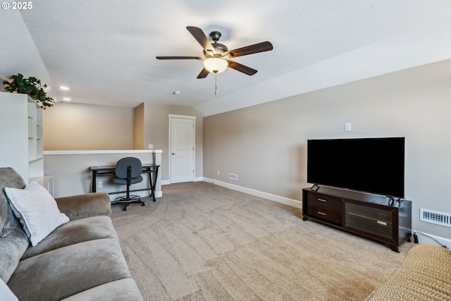 4905 S 12th Cir, Ridgefield, WA 98642 - carpeted living room featuring ceiling fan, a textured ceiling, and an office area