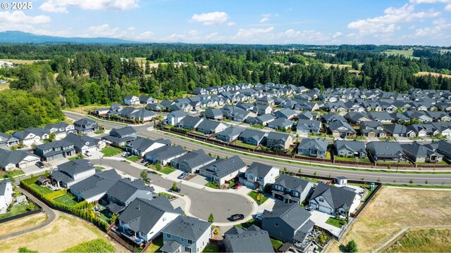 4905 S 12th Cir, Ridgefield, WA 98642 - aerial overview of property's location with nearby suburban area and a heavily wooded area