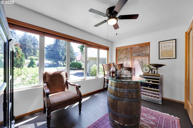office space with wine cooler, plenty of natural light, and baseboards