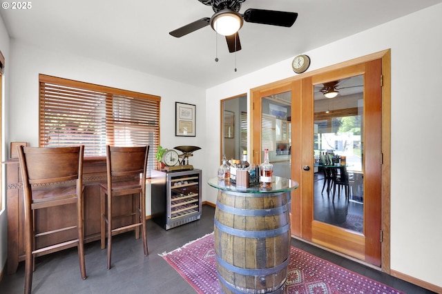 office area with beverage cooler and ceiling fan