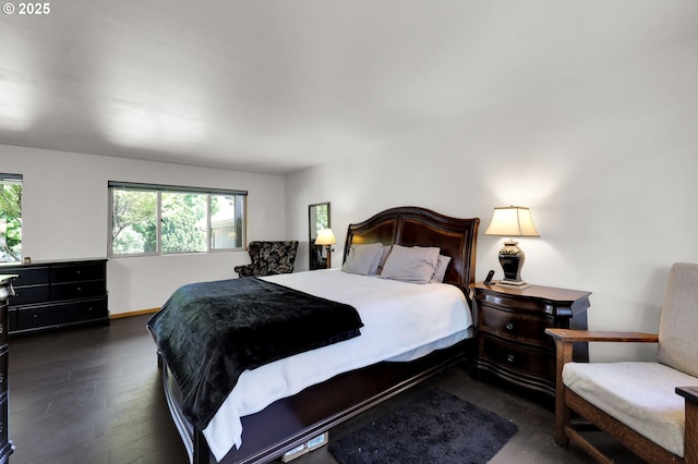 bedroom featuring dark wood-type flooring