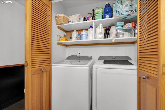 clothes washing area featuring washer and clothes dryer