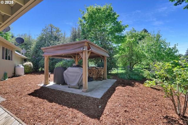 view of yard with fence, a gazebo, and a patio