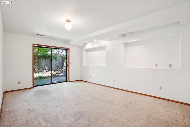 2027 SE Lexington St, Portland, OR 97202 - empty room featuring carpet flooring and a textured ceiling