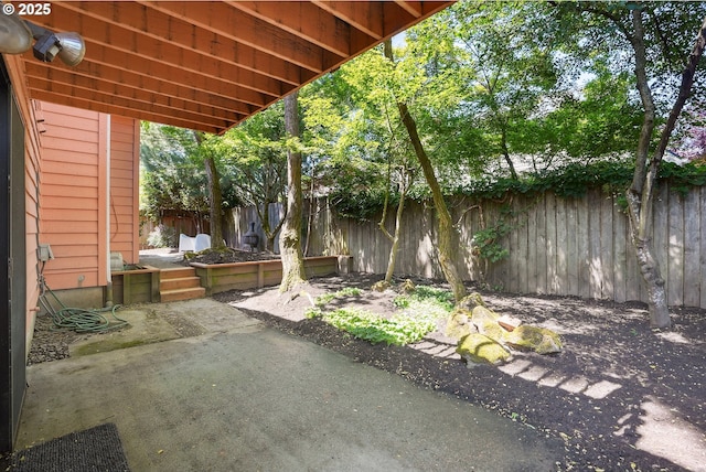 2027 SE Lexington St, Portland, OR 97202 - fenced backyard featuring a patio