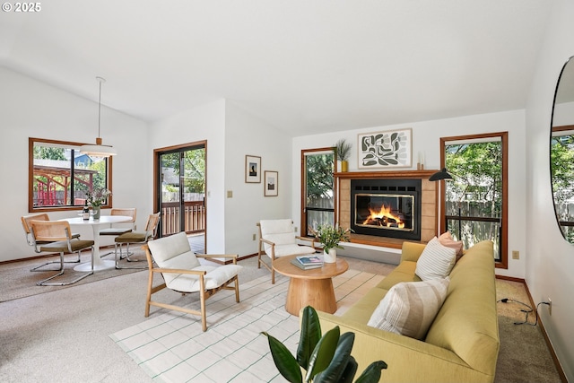 2027 SE Lexington St, Portland, OR 97202 - living area with lofted ceiling, light colored carpet, plenty of natural light, and a glass covered fireplace