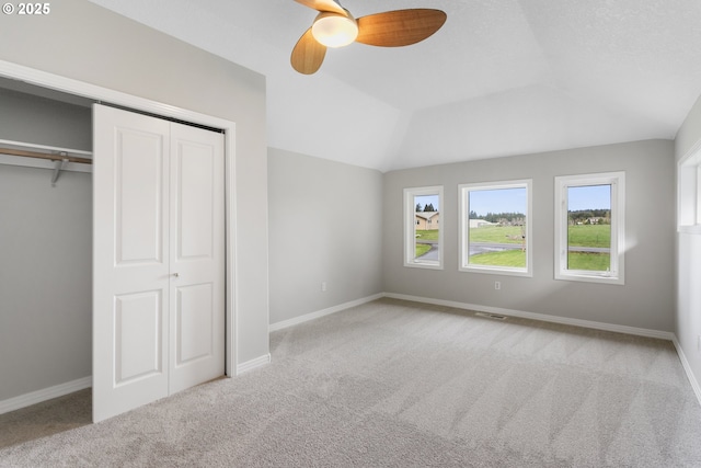 unfurnished bedroom with baseboards, carpet, and visible vents