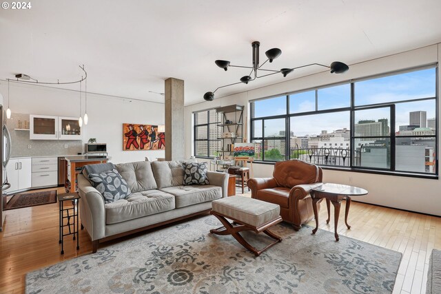 333 NW 9th Ave Unit 1205, Portland, OR 97209 - living area featuring hardwood / wood-style flooring and a chandelier