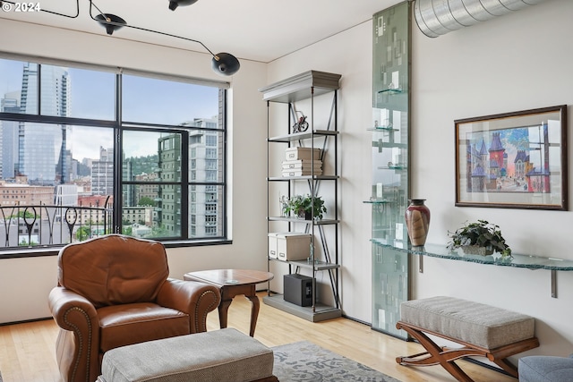 333 NW 9th Ave Unit 1205, Portland, OR 97209 - living area with a city view and wood finished floors