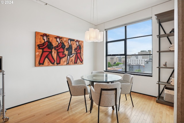 333 NW 9th Ave Unit 1205, Portland, OR 97209 - dining space featuring hardwood / wood-style floors