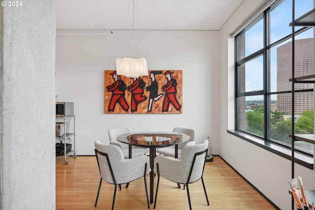 333 NW 9th Ave Unit 1205, Portland, OR 97209 - dining room with light wood-style flooring