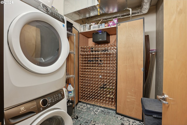 333 NW 9th Ave Unit 1205, Portland, OR 97209 - clothes washing area featuring stacked washing machine and dryer