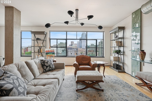 333 NW 9th Ave Unit 1205, Portland, OR 97209 - living room with light wood-type flooring, a view of city, and a chandelier