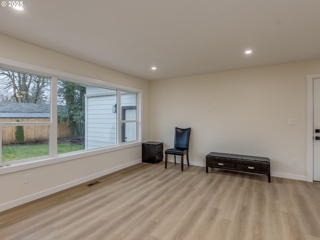 sitting room with light hardwood / wood-style floors