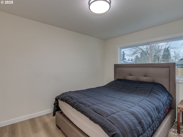 bedroom with light hardwood / wood-style floors