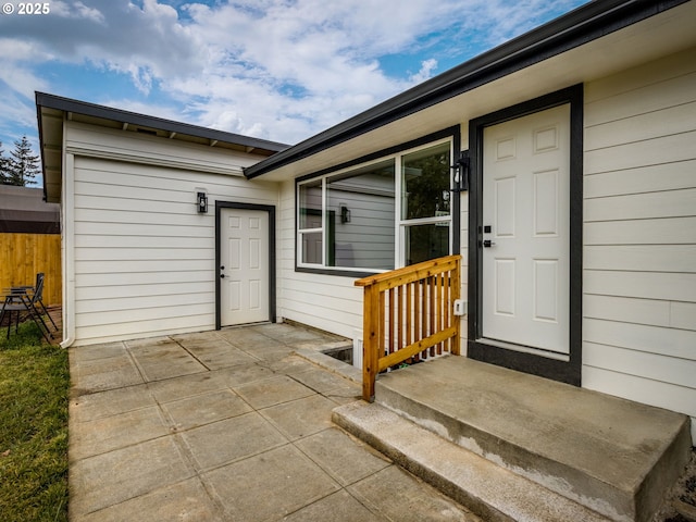 doorway to property with a patio