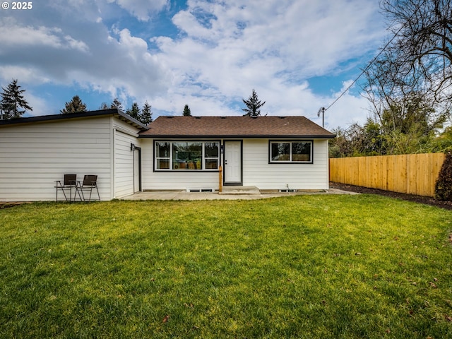 view of front of house featuring a front lawn and a patio