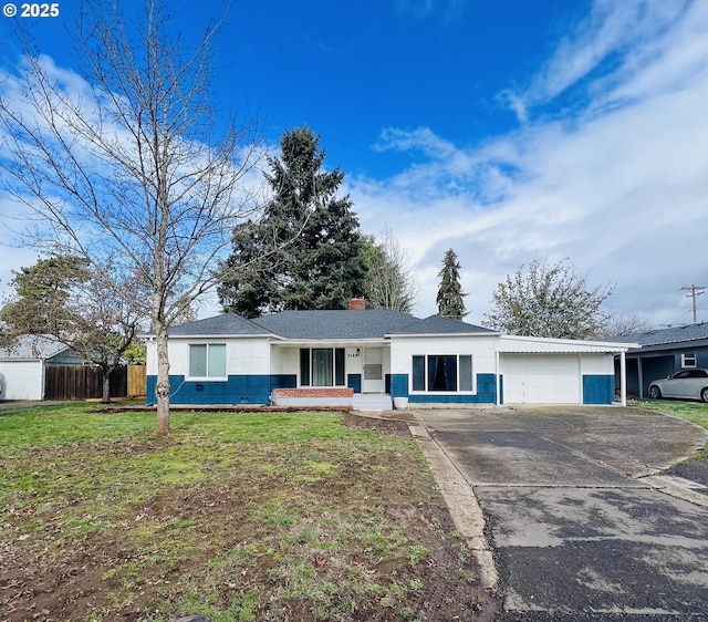 ranch-style home with fence, an attached garage, a chimney, concrete driveway, and a front lawn