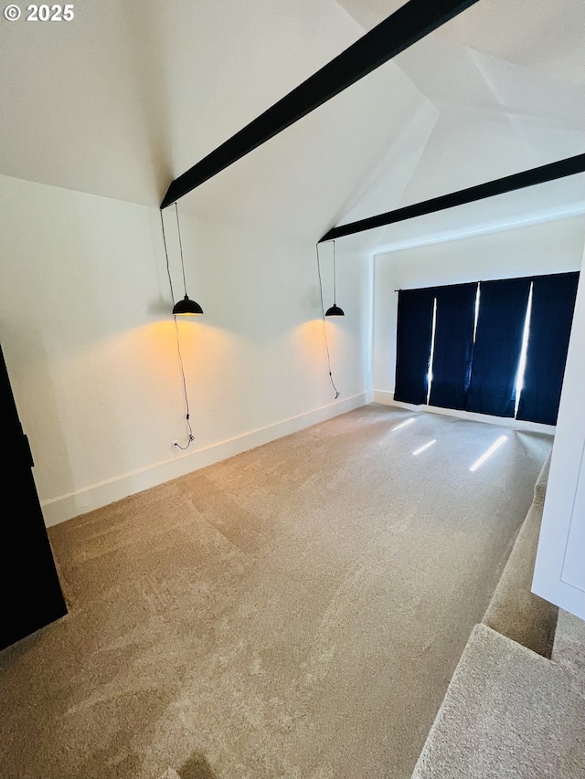 living area with carpet flooring, vaulted ceiling with beams, and baseboards